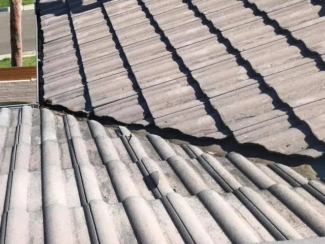 The same tile roof valley after cleaning, clear of leaves